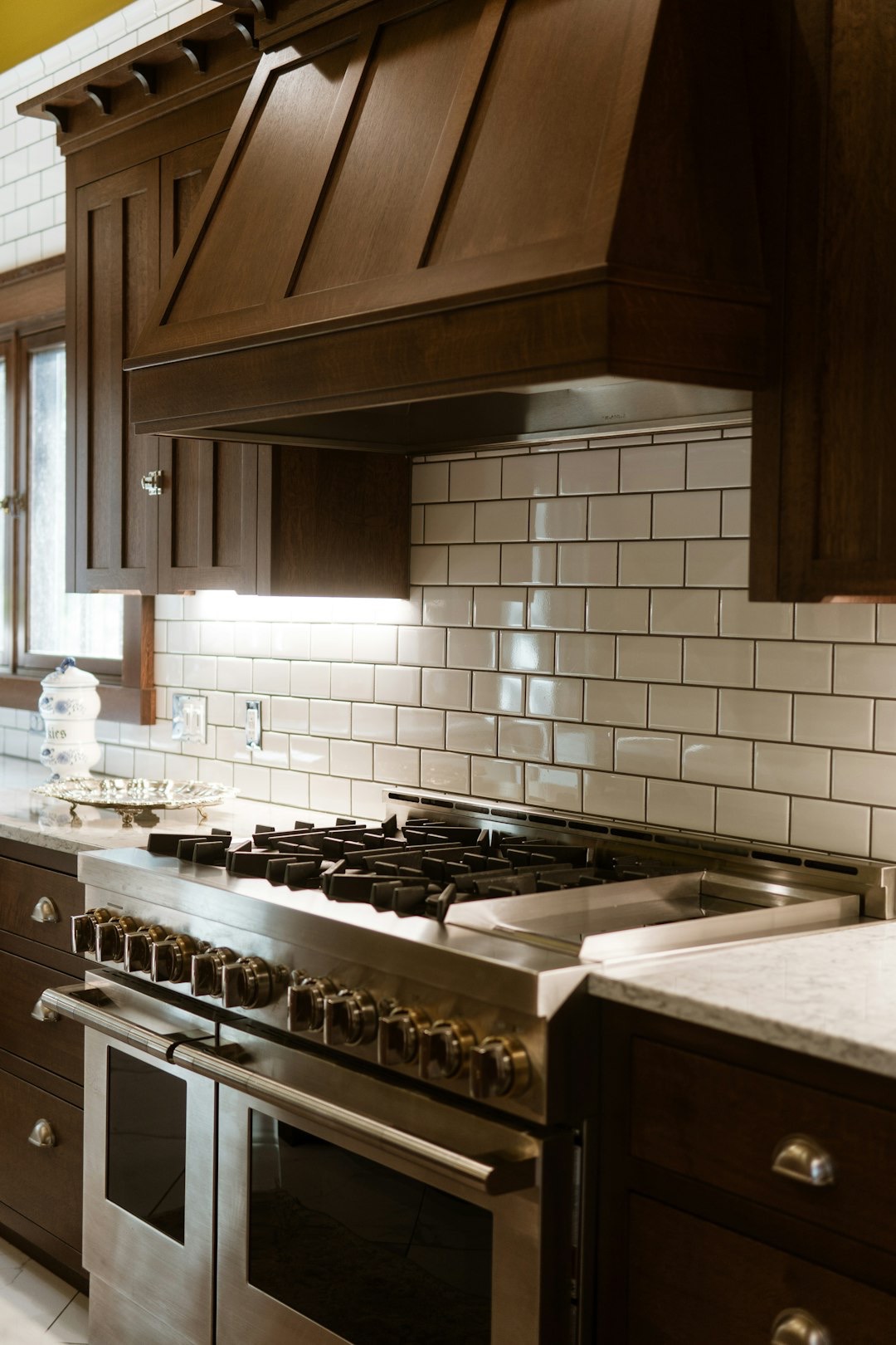 Stainless steel range integrated into a modern kitchen countertop.